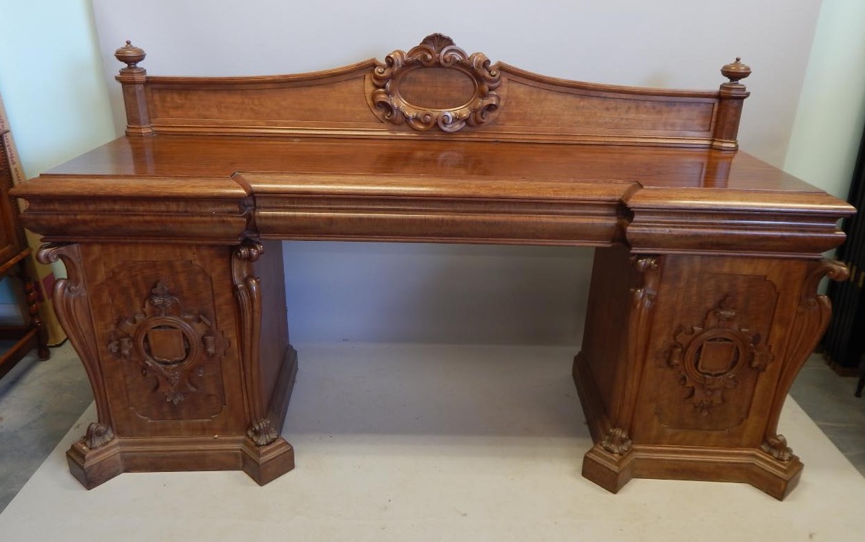 Appraisal: A Victorian plum pudding and figured mahogany pedestal sideboard the