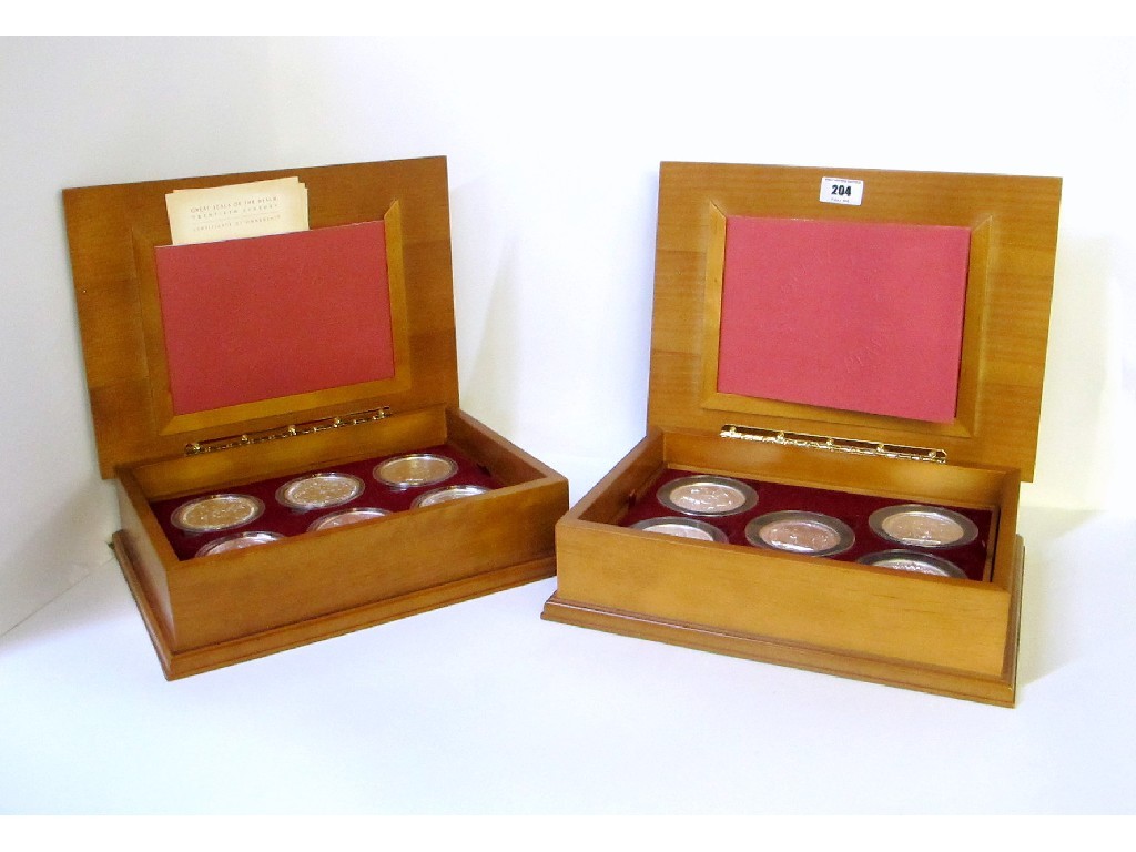 Appraisal: A lot comprising two cased sets of medallions depicting the