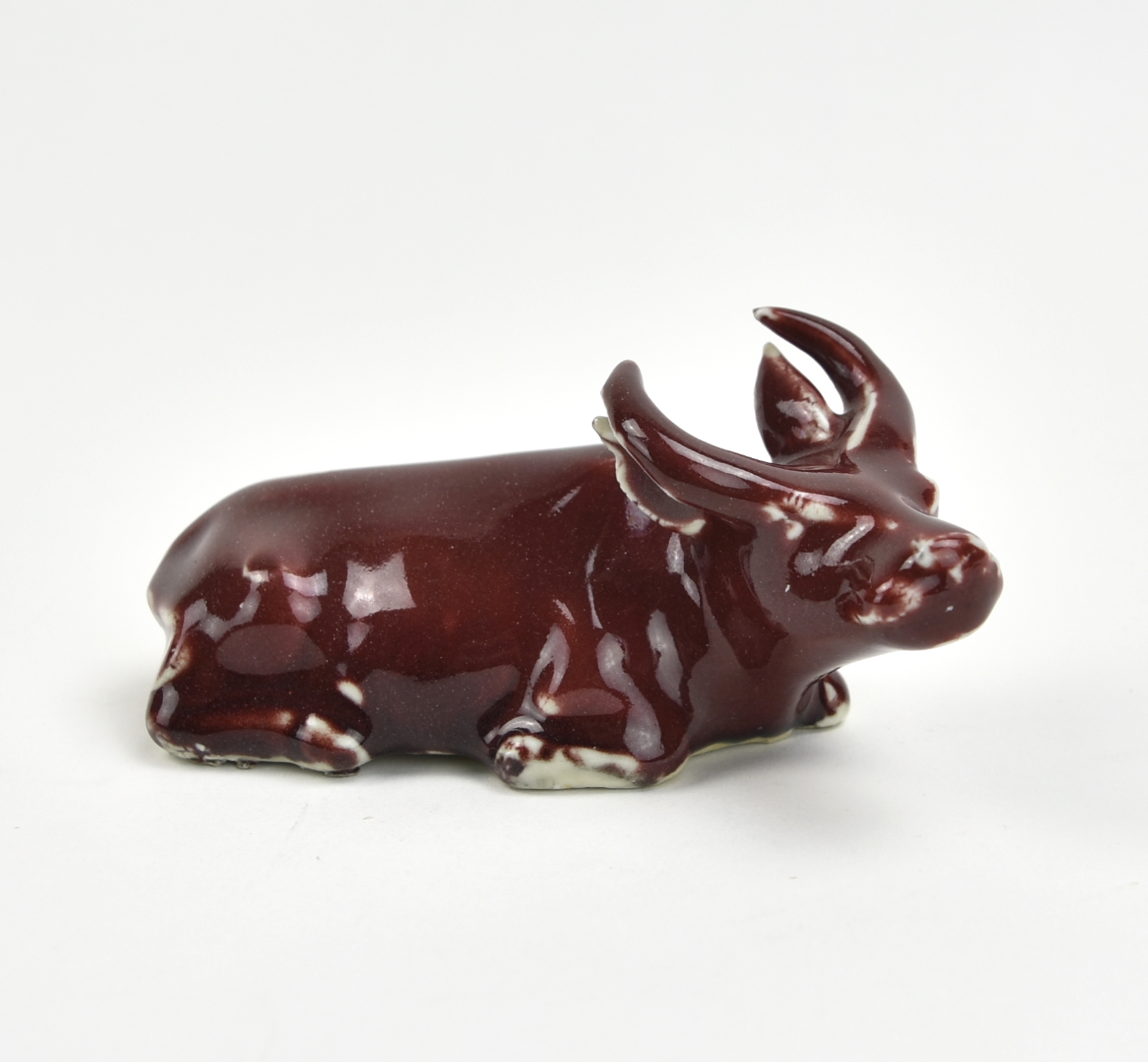 Appraisal: cattle ornament in red glazed bottom unglazed H cm L