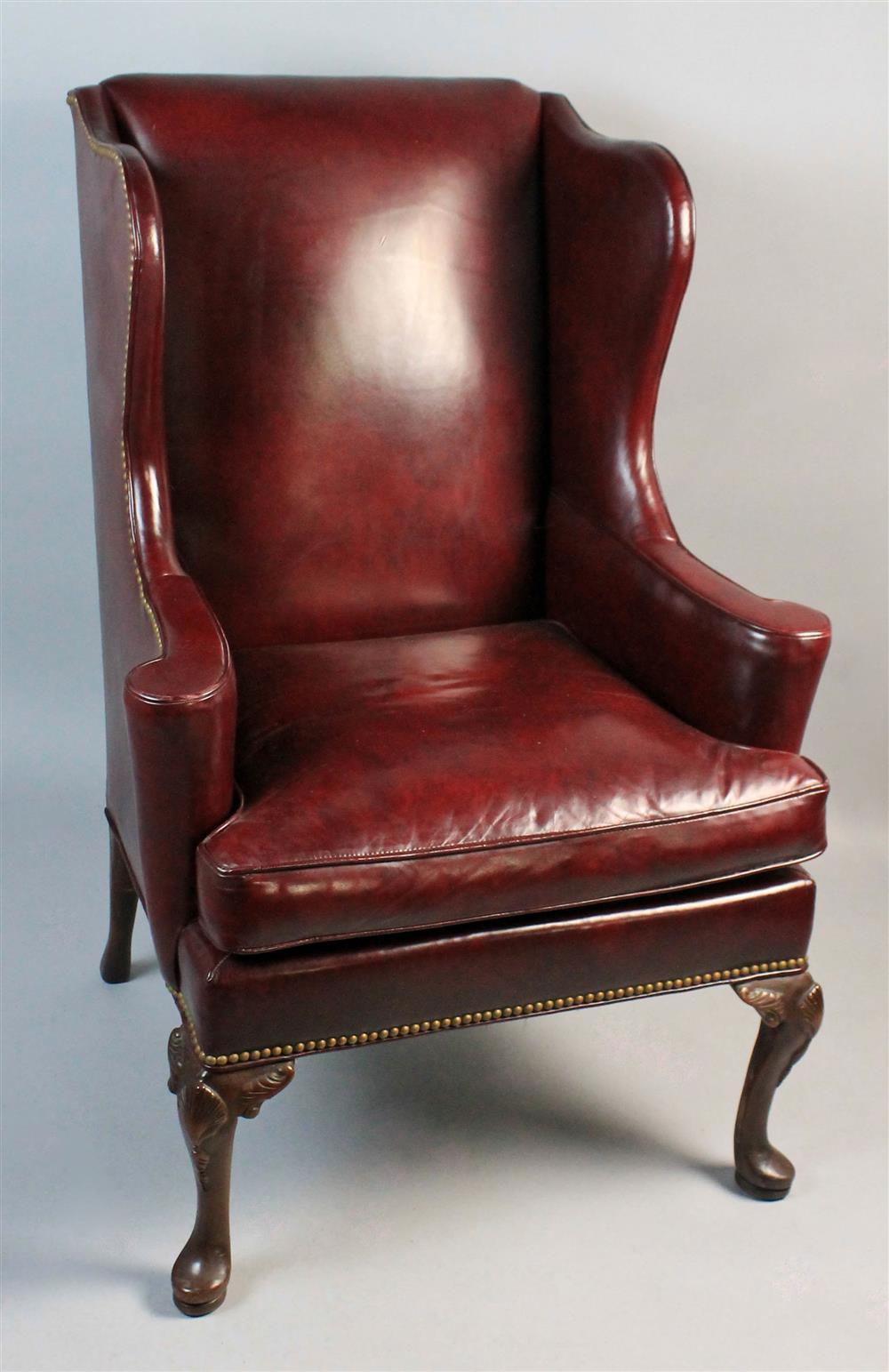 Appraisal: HICKORY CHAIR CO BURNISHED BURGUNDY LEATHER WING CHAIR WITH FULL