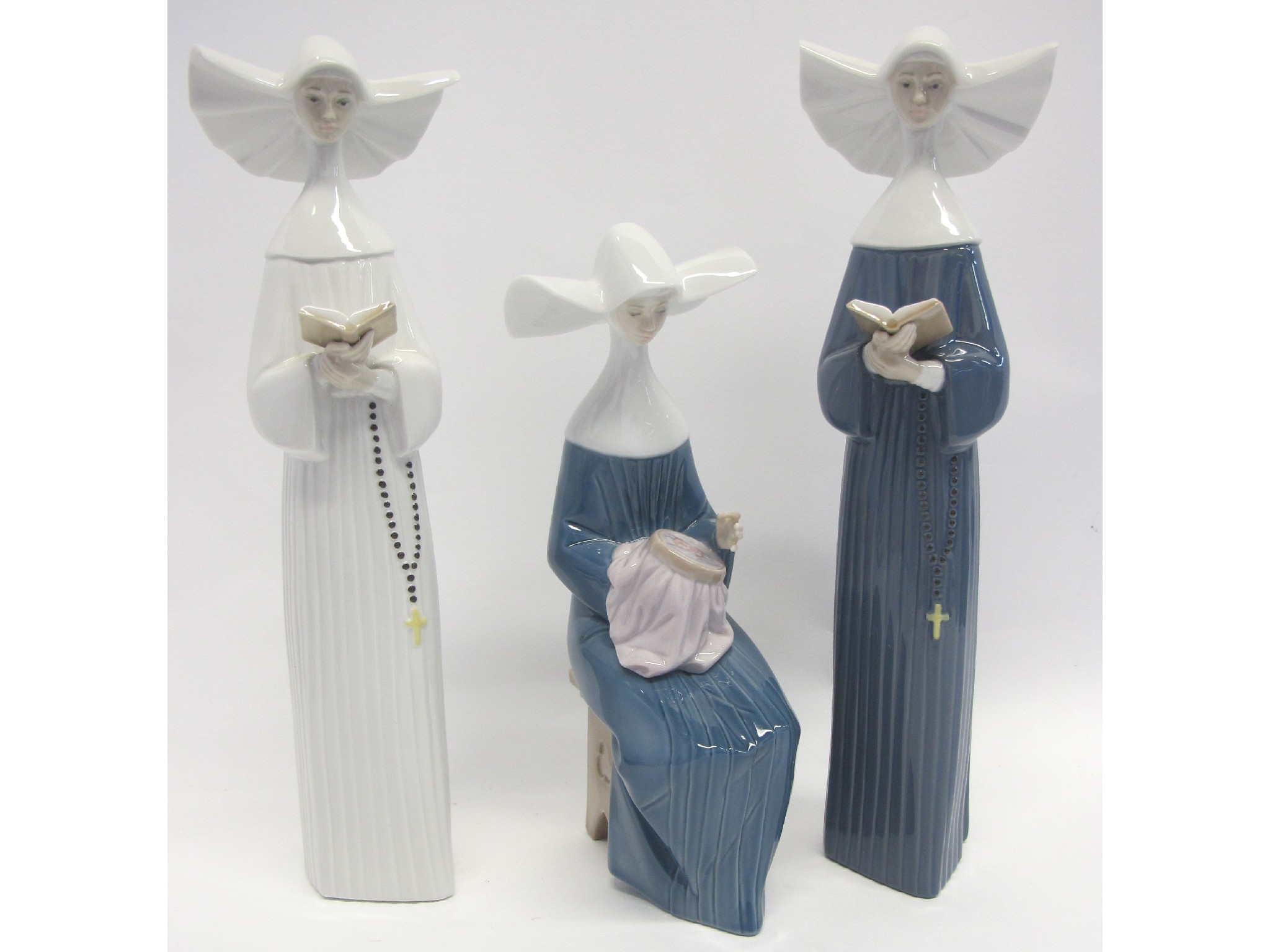 Appraisal: Three Lladro porcelain figures of nuns