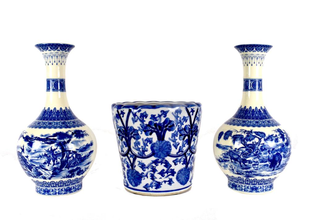 Appraisal: THREE BLUE AND WHITE DECORATED EARTHENWARE VESSELSModern Comprising a pair