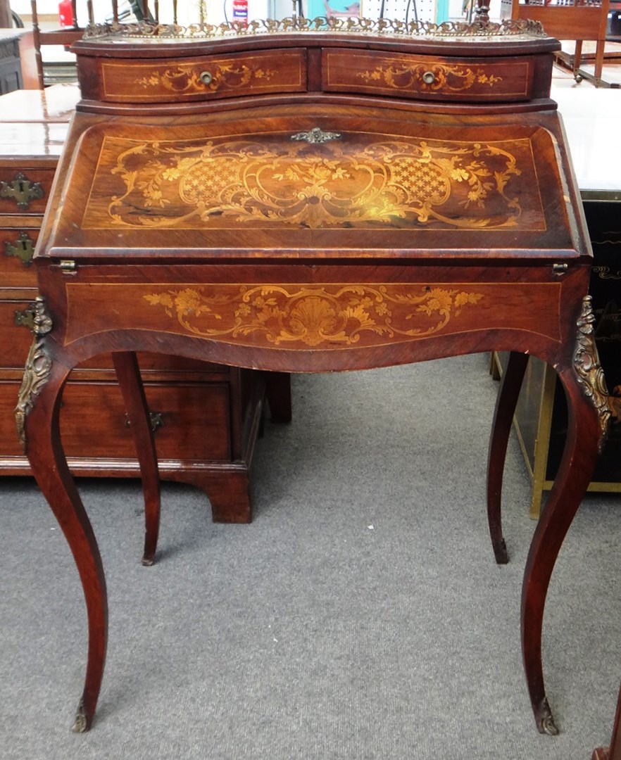 Appraisal: A late th century French gilt metal mounted marquetry inlaid