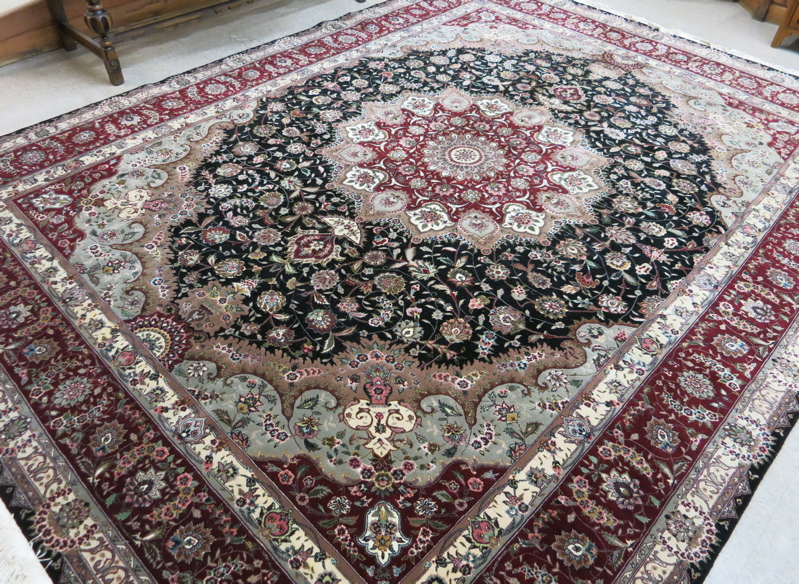 Appraisal: HAND KNOTTED ORIENTAL WOOL AND SILK CARPET Indo-Persian floral and