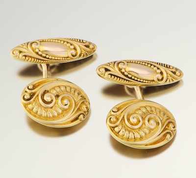 Appraisal: A Pair of Scroll Design Cufflinks k yellow gold oval