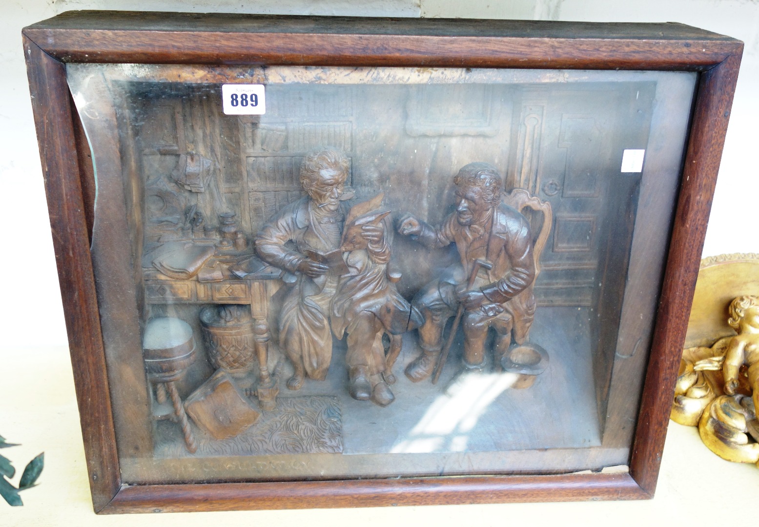 Appraisal: A Continental carved walnut group entitled 'The Consultation' C depicting