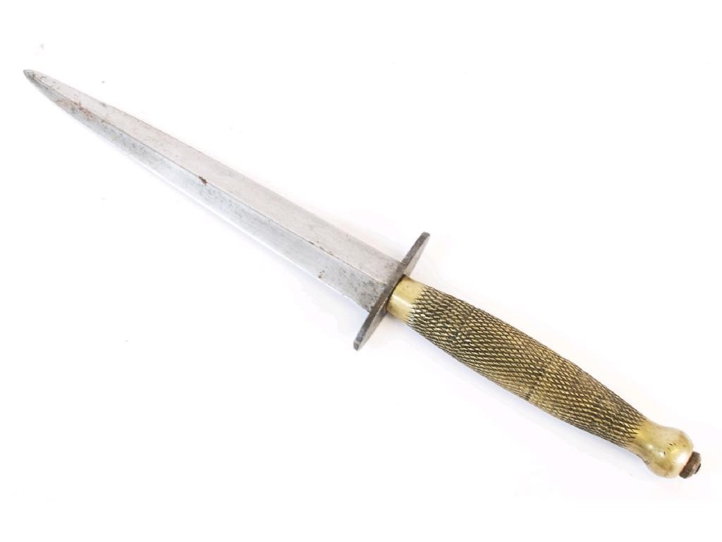 Appraisal: WORLD WAR II FIGHTING DAGGER with chequered brass grip with