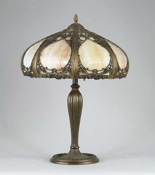 Appraisal: SLAG PANEL TABLE LAMP The shade with eight curved caramel