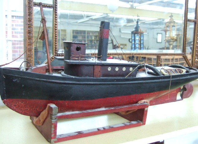 Appraisal: A scratch built wooden steam boat painted in red and