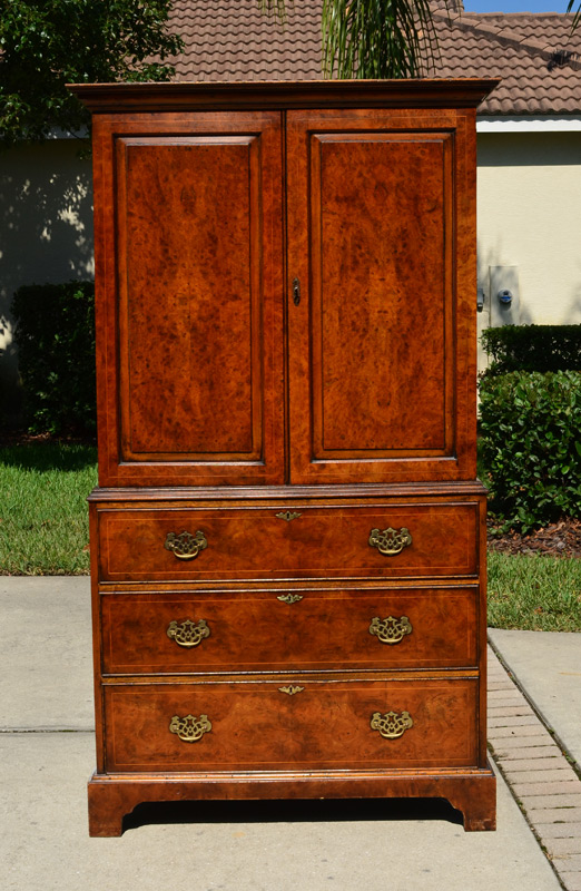 Appraisal: SOUTHAMPTON BURL WALNUT LINEN PRESS Burl walnut veneer doors with