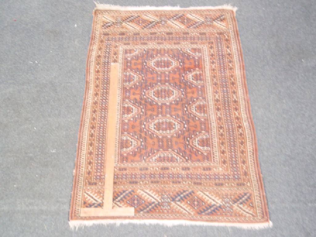 Appraisal: An orange and brown Bokhara type rug cm x cm