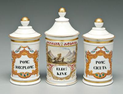 Appraisal: Three porcelain apothecary jars pair lidded jars with urn finials