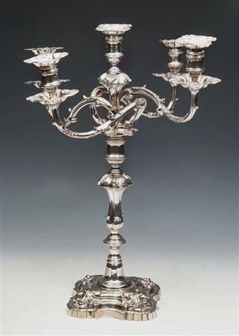 Appraisal: A GEORGE IV SHEFFIELD PLATED FIVE BRANCH CANDELABRUM of open