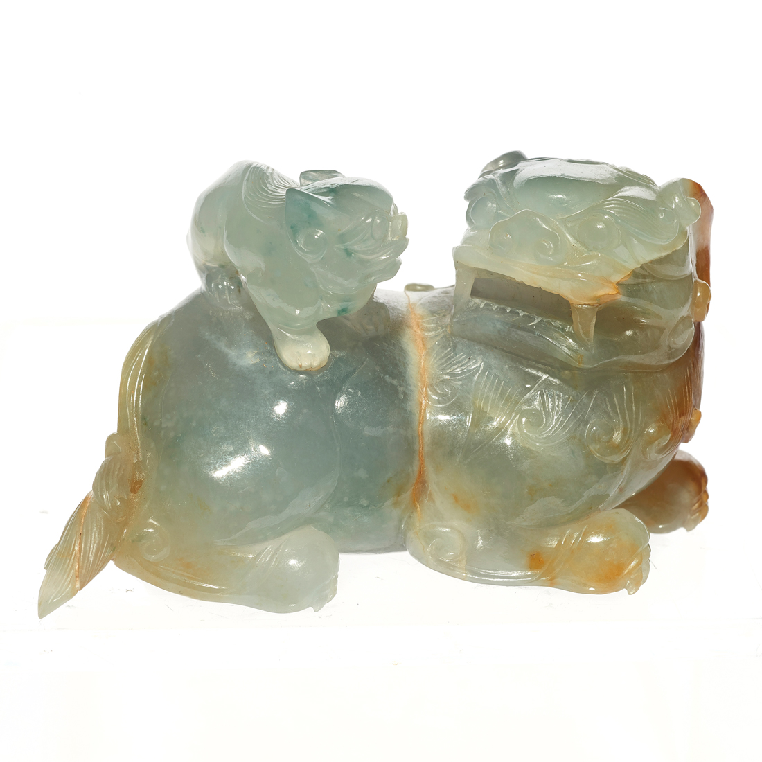 Appraisal: CHINESE RUSSET JADEITE LION GROUP Chinese russet jadeite lion group