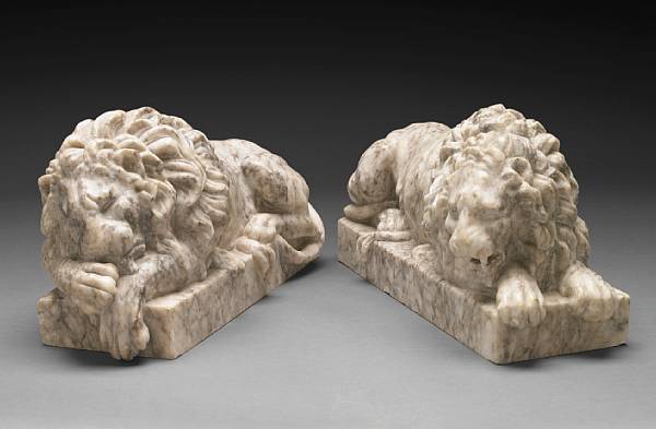 Appraisal: A pair of Italian carved marble models of lions after