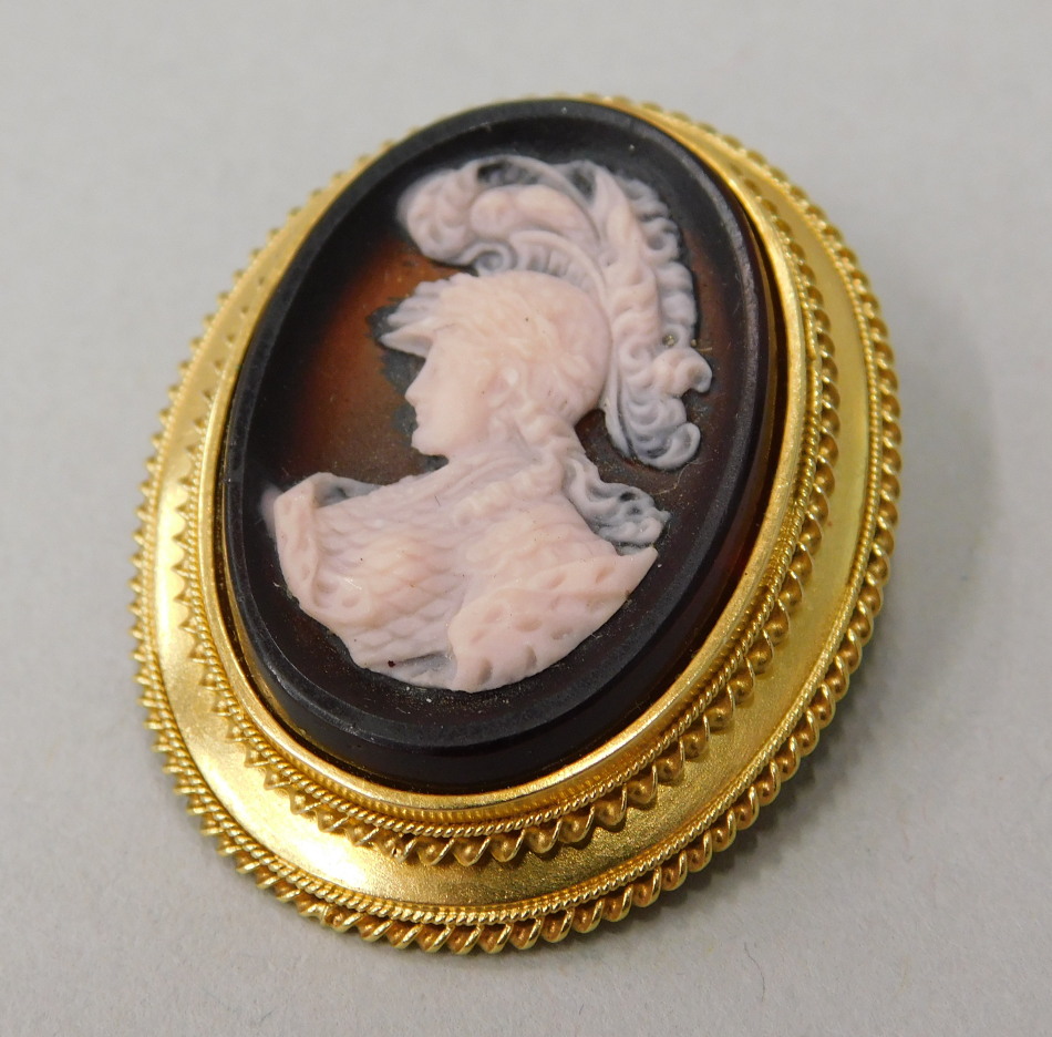 Appraisal: A cameo set pendant brooch the amber coloured cameo with