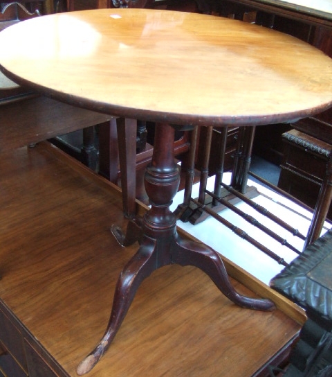 Appraisal: An early th century mahogany occasional table the circular snap