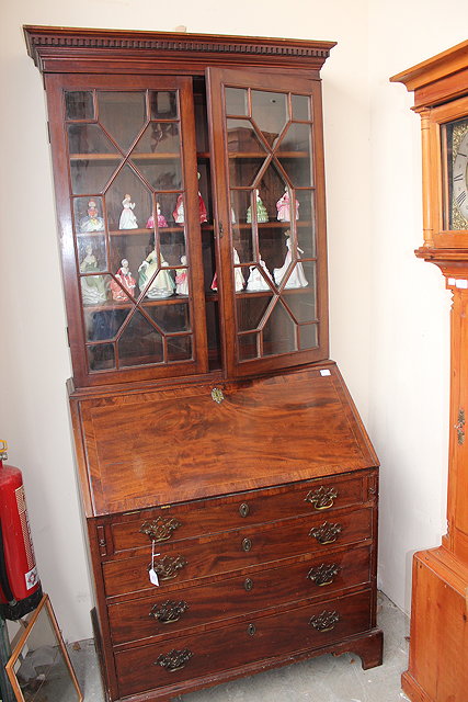 Appraisal: A GEORGE III MAHOGANY BUREAU BOOKCASE the top with a