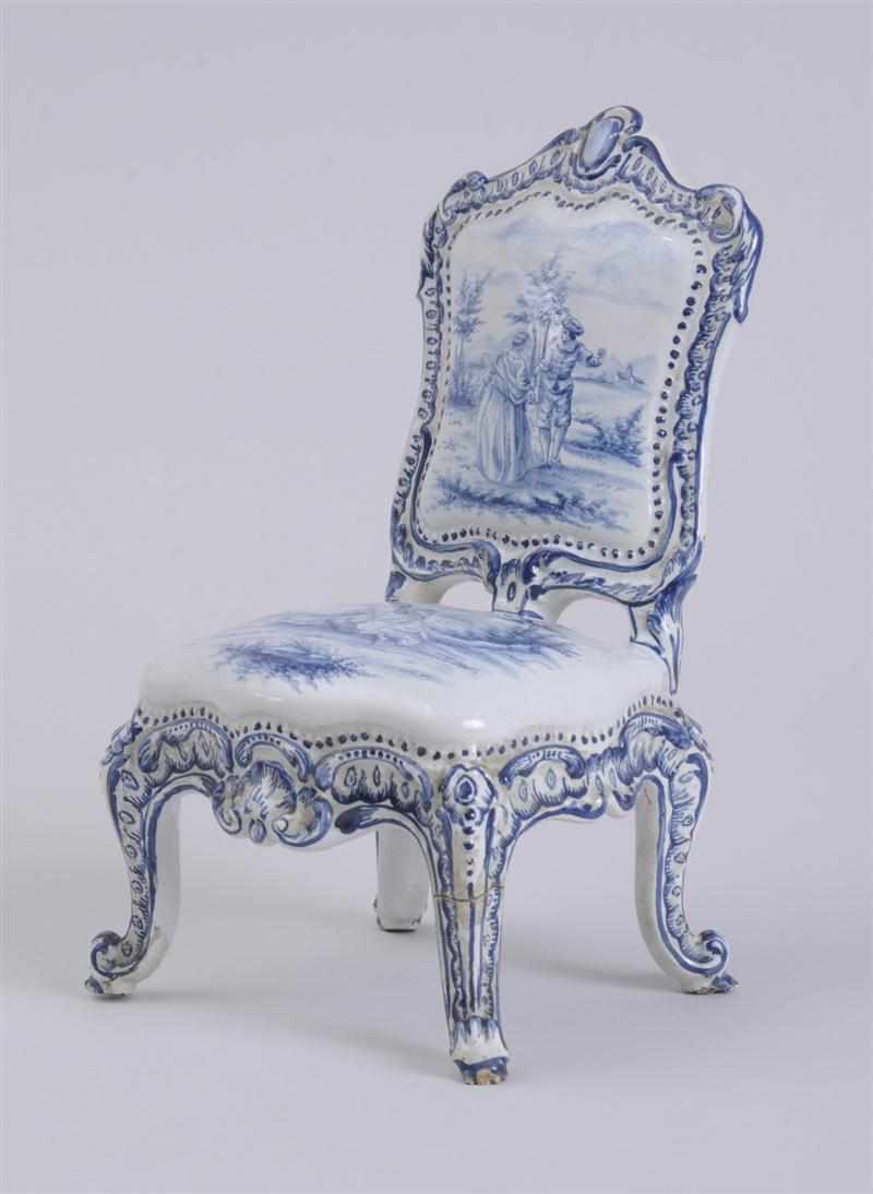 Appraisal: DELFT BLUE AND WHITE MODEL OF A LOUIS XV CHAISE