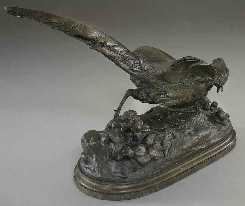 Appraisal: Paul Comolera bronze sculpture depicting a pheasant and snails on