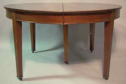 Appraisal: HEPPLEWHITE STYLE STRING INLAID MAHOGANY EXTENSION DINING TABLE the circular