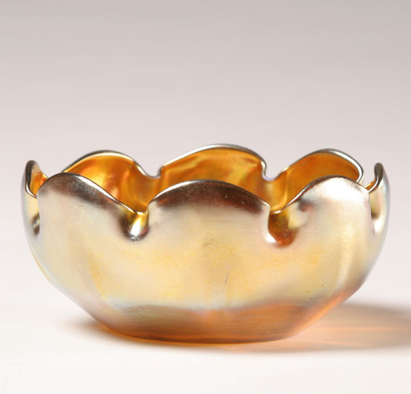 Appraisal: Tiffany gold Favrile art glass bowl with a scalloped rim