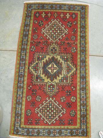 Appraisal: Heriz Persian Handmade Rug triple geometric medallions red field '