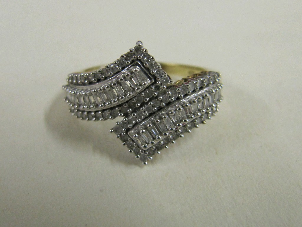 Appraisal: Nine carat bi colour gold baguette and brilliant cut diamond