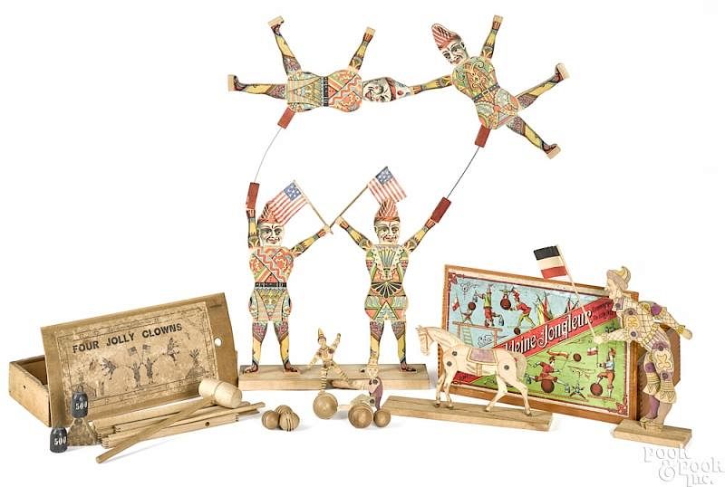 Appraisal: Two wooden circus clowns and juggling toys Two wooden circus