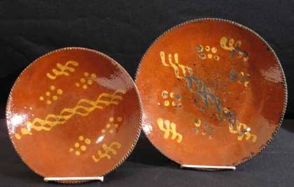 Appraisal: Two decorated redware plates th and th century Dia in