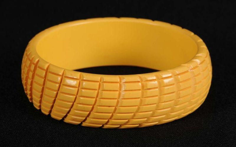 Appraisal: Bakelite Carved Curvilinear Design Bracelet Condition Near Mint Size Dia