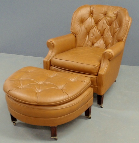 Appraisal: - Chippendale style leather tub chair and matching footstool h