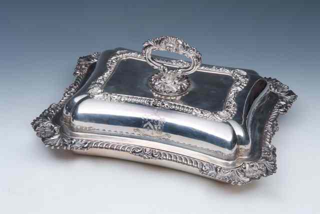 Appraisal: A GEORGE III SILVER ENTREE DISH AND COVER with gadrooned