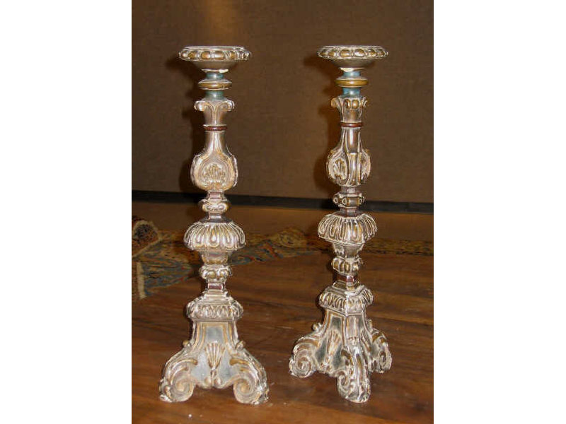 Appraisal: PAIR OF ANTIQUE CARVED WOOD CANDLESTANDS Baroque style triangular form