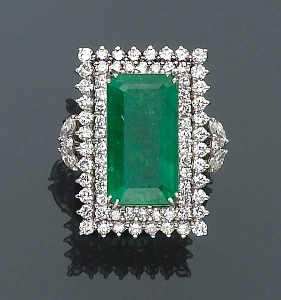 Appraisal: An emerald and diamond ring centering rectangular-shaped emerald estimated total