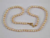 Appraisal: A cultured pearl necklace with a yellow metal tests carat