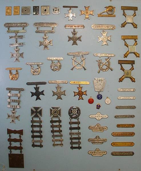 Appraisal: A group of marksmanship qualification badges Comprising over examples Three