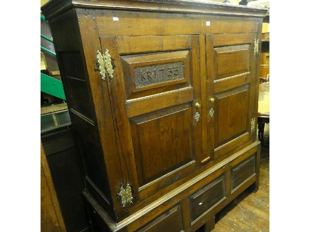 Appraisal: An th century oak livery cupboard enclosed by a pair