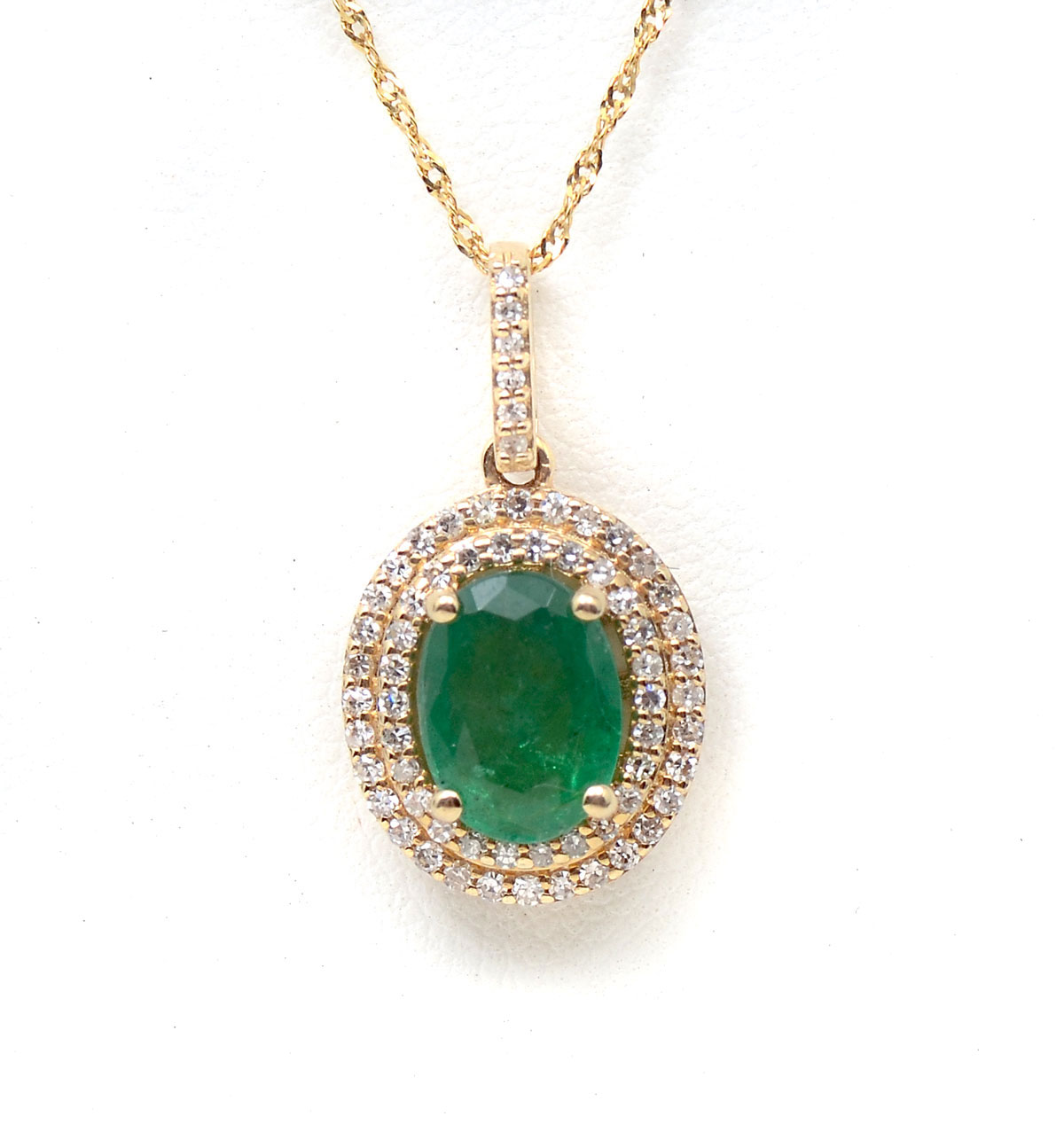 Appraisal: K EMERALD DIAMOND PENDANT K yellow gold pendant contains one