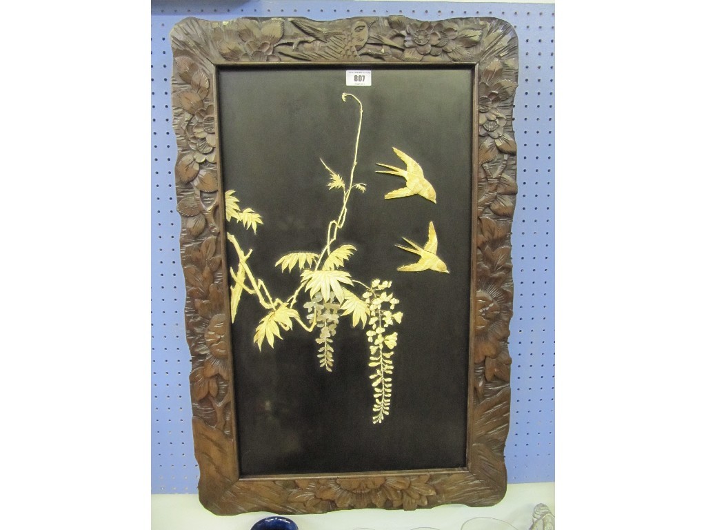 Appraisal: Carved wooden framed Japanese panel depicting birds and wisteria