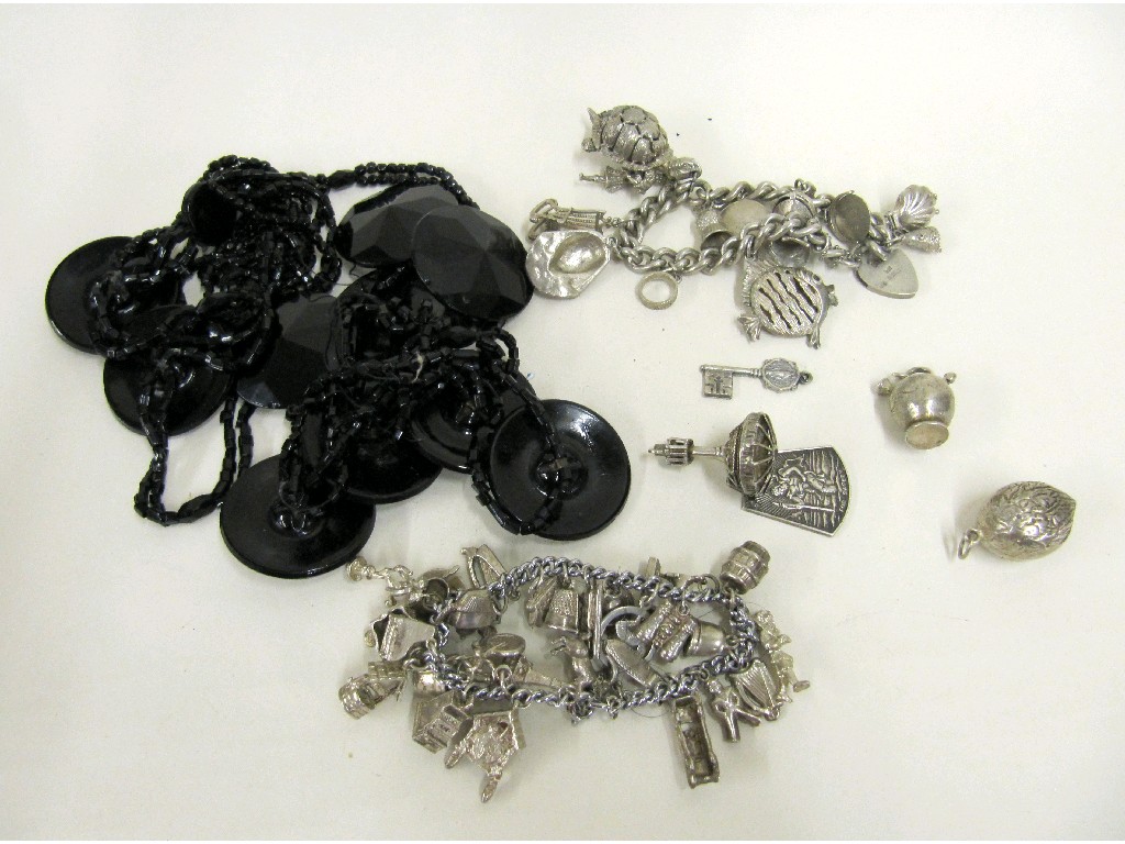 Appraisal: Lot comprising two white metal charm bracelets and a long