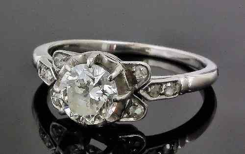 Appraisal: An early th Century silvery coloured metal mounted diamond solitaire