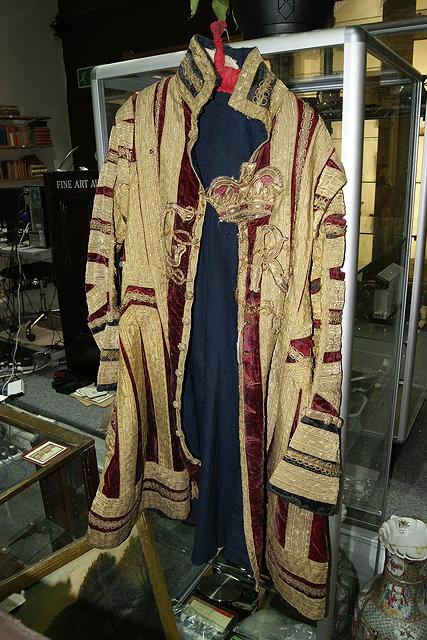 Appraisal: A ROYAL LIVERY COAT with velvet and gold thread the