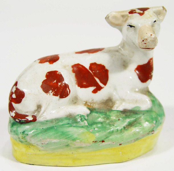 Appraisal: Victorian hand painted Staffordshire pottery cow cm high