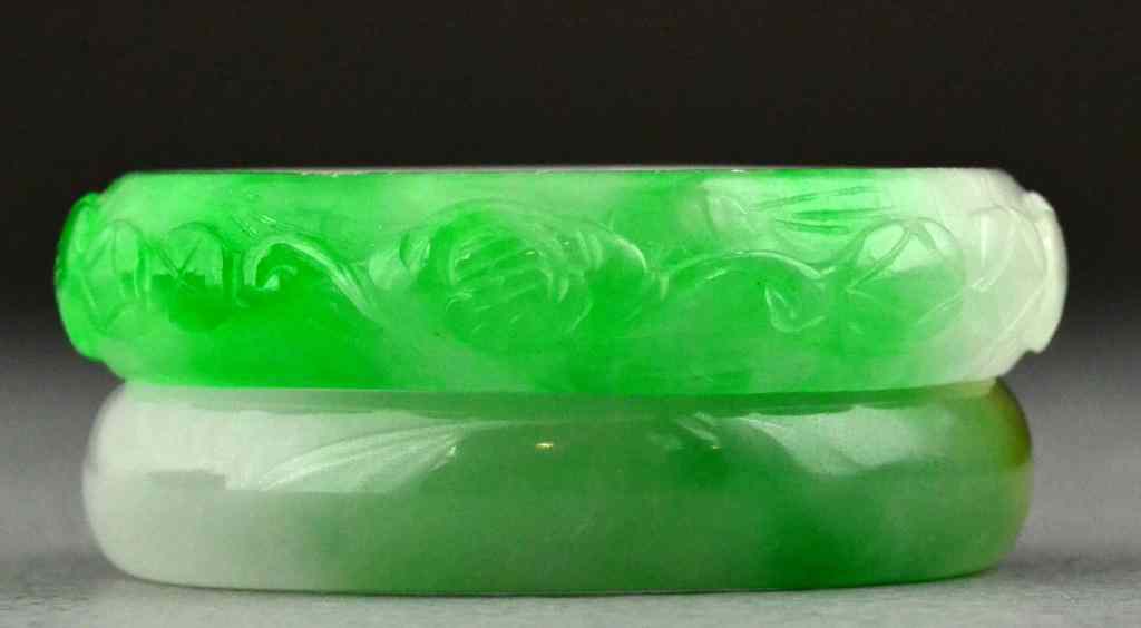 Appraisal: Chinese Carved Jade BanglesOne finely carved to depict lotus blossoms