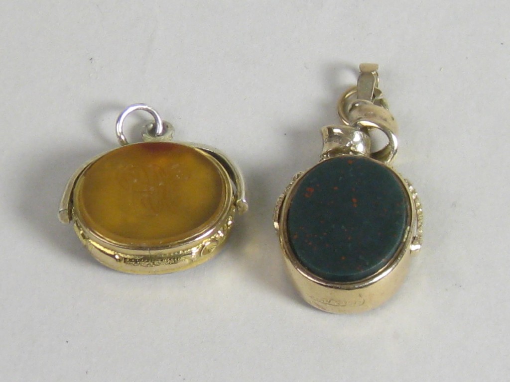 Appraisal: A ct gold swivel Fob inset hardstone engraved initials and