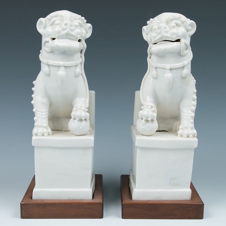 Appraisal: PAIR OF DEHUA FU LIONS TH TH C Each modeled