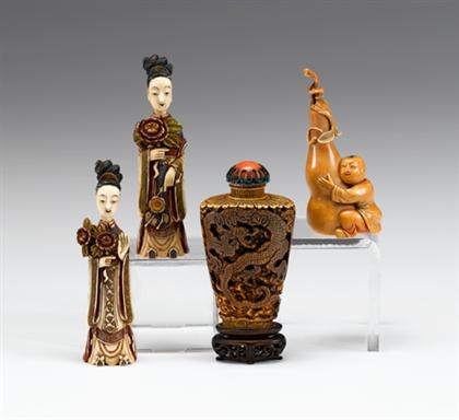 Appraisal: Four Chinese elephant ivory snuff bottles Three with incised qianlong