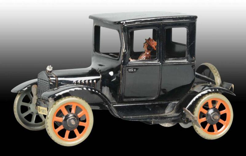 Appraisal: German Tin Wind-Up Bing Model T Coupe Toy Description Working