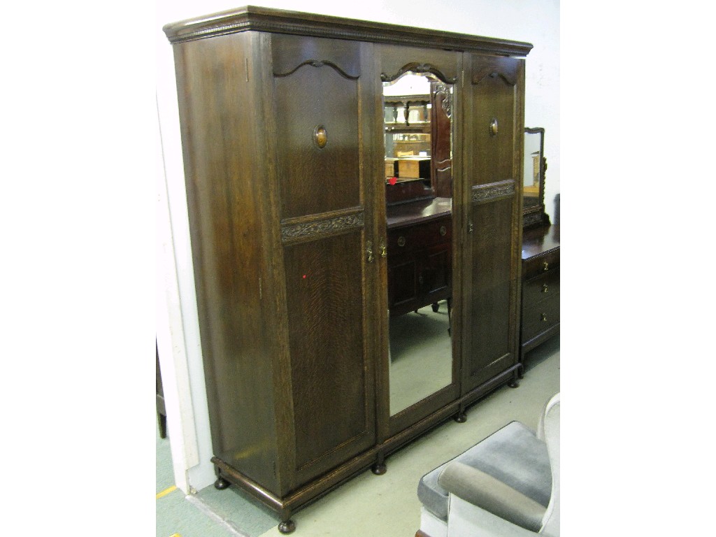 Appraisal: Oak Jacobean style bedroom suite comprising triple wardrobe dressing table